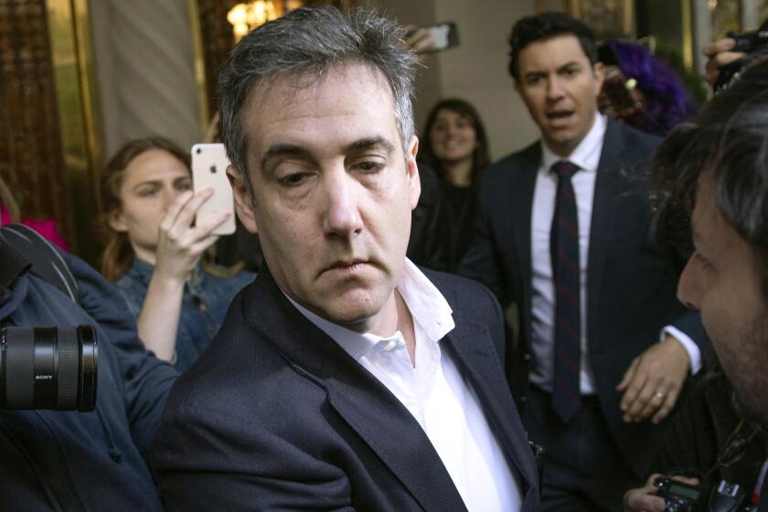 FILE - In this May 6, 2019, file photo, Michael Cohen, former attorney to President Donald Trump, leaves his apartment building before beginning his prison term in New York. President Trump’s former lawyer and longtime fixer Cohen will be released from federal prison to serve the remainder of his sentence in home confinement amid the coronavirus pandemic, a person familiar with the matter told The Associated Press. (AP Photo/Kevin Hagen, File)