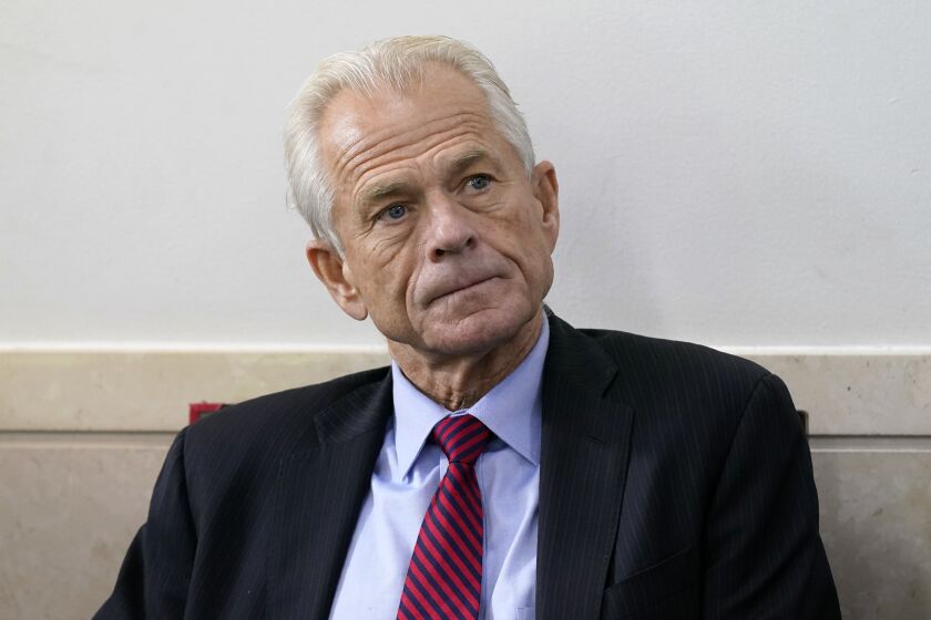 FILE - White House trade adviser Peter Navarro listens as President Donald Trump speaks during a news conference at the White House, Aug. 14, 2020, in Washington. The House committee investigating the U.S. Capitol insurrection subpoenaed former White House trade adviser Peter Navarro on Wednesday, Feb. 9, 2022, seeking to question an ally of former President Donald Trump who promoted false claims of voter fraud in the 2020 election. (AP Photo/Patrick Semansky, File)