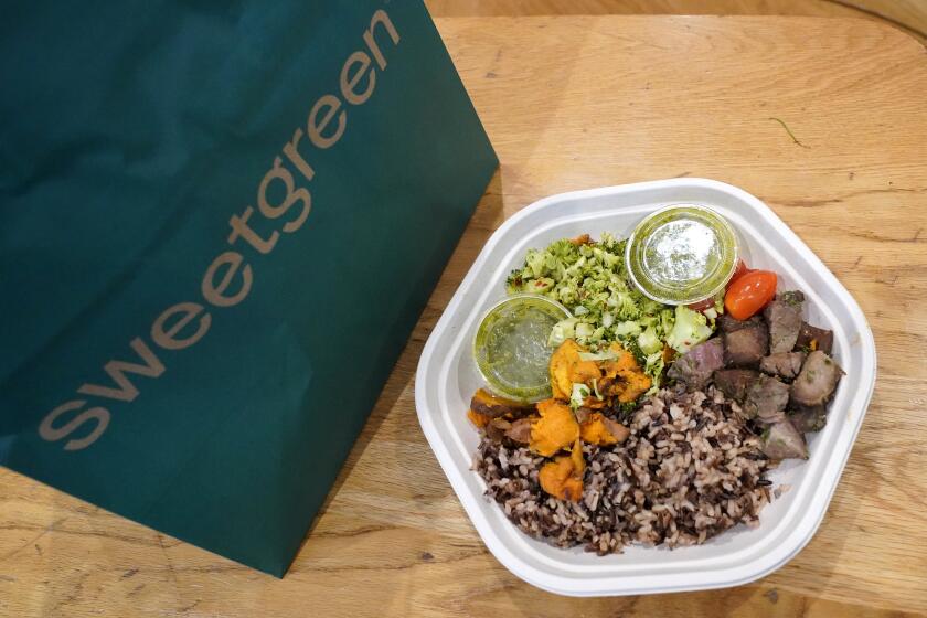 Sweetgreen's new caramelized garlic steak bowl sits on the table on Thursday, May 9, 2024, in New York. The announcement of Sweetgreen that it’s adding beef to its menu led to strong reactions online, with customers questioning the company’s carbon neutral plans. (AP Photo)