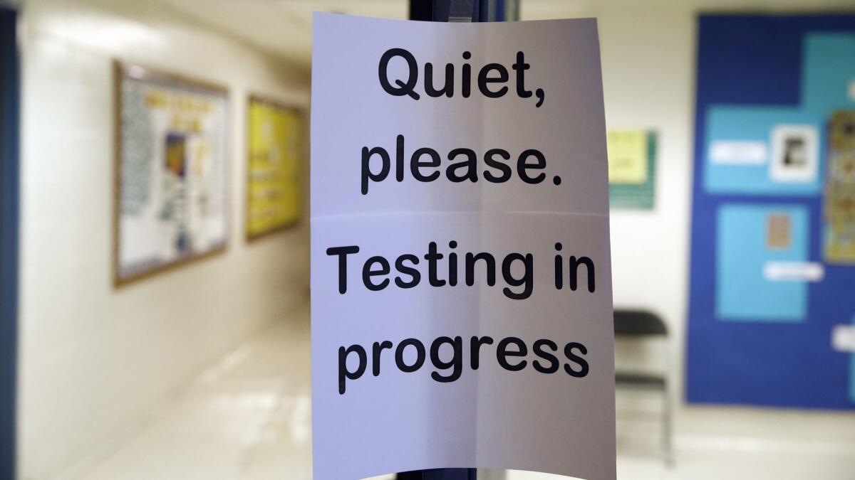 A sign is seen at the entrance to a hall for a college test preparation class in Bethesda, Md. on Jan. 17, 2016.