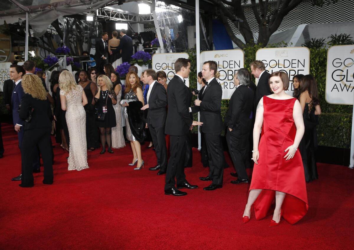 Lena Dunham wears Zac Posen at the 72nd Annual Golden Globe Awards.