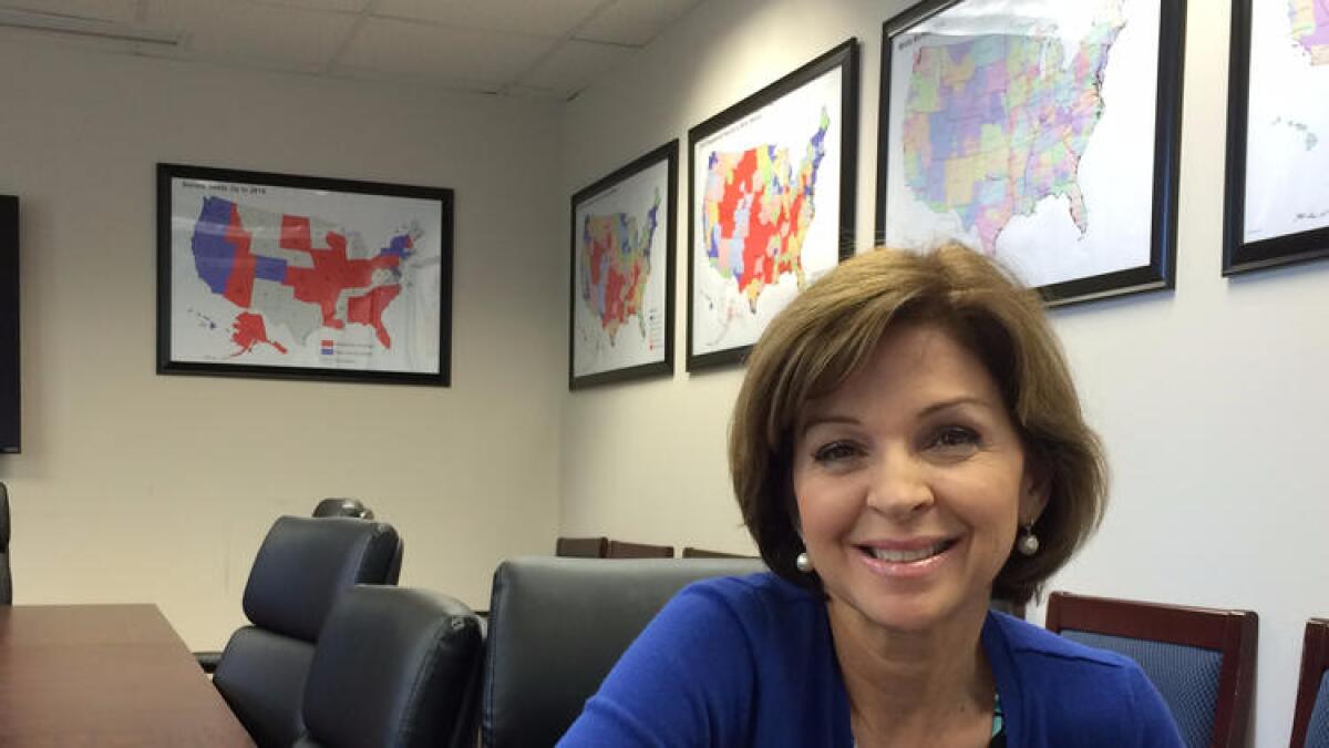 Helen Aguirre Ferre, shown at Republican National Committee headquarters in Washington, has one of the hardest jobs in politics today — selling Donald Trump to Latino voters.