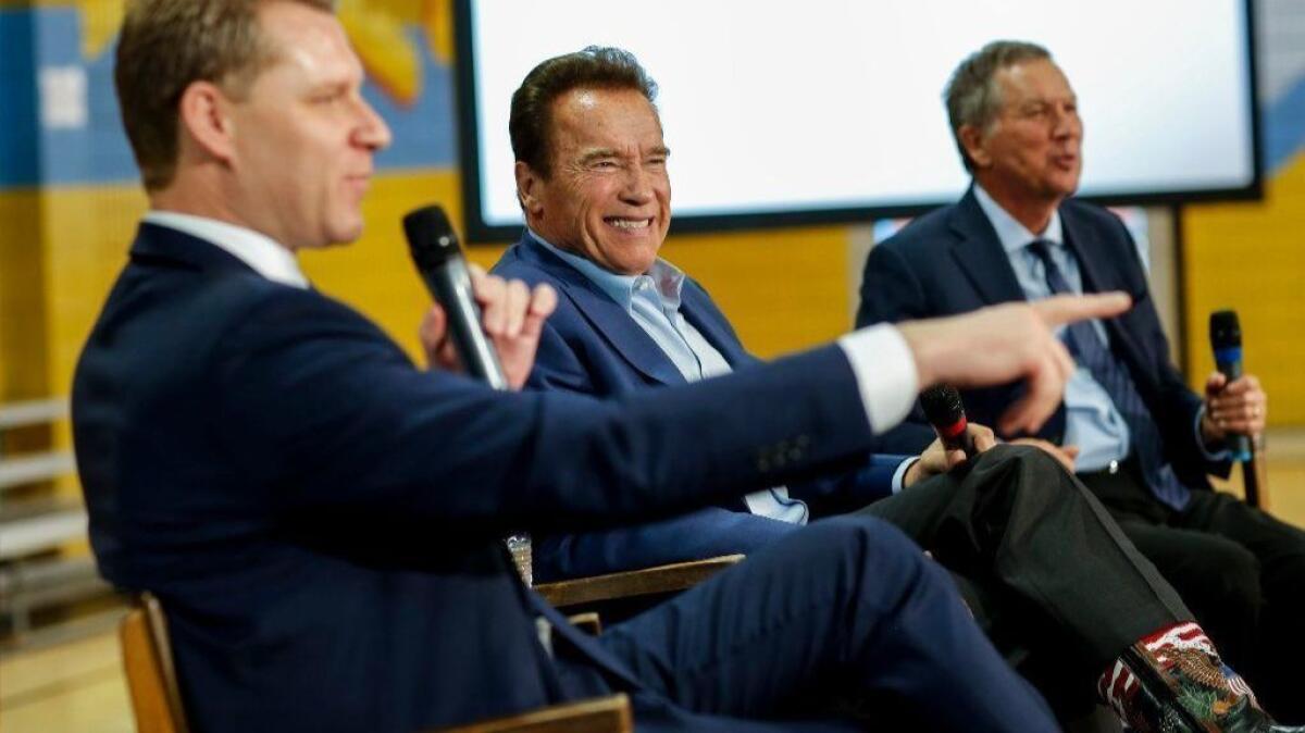 Assemblyman Chad Mayes, left, former Gov. Arnold Schwarzenegger and Ohio Gov. John Kasich at an event in Los Angeles on March 21.