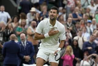  Novak Djokovic reacts after beating Italy's Jannik Sinner in a Wimbledon men's singles semifinal match Friday.