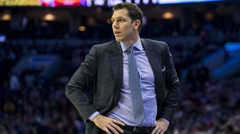 Lakers coach Luke Walton looks on during the first half the team's 143-120 loss to the Philadelphia 76ers on Sunday.