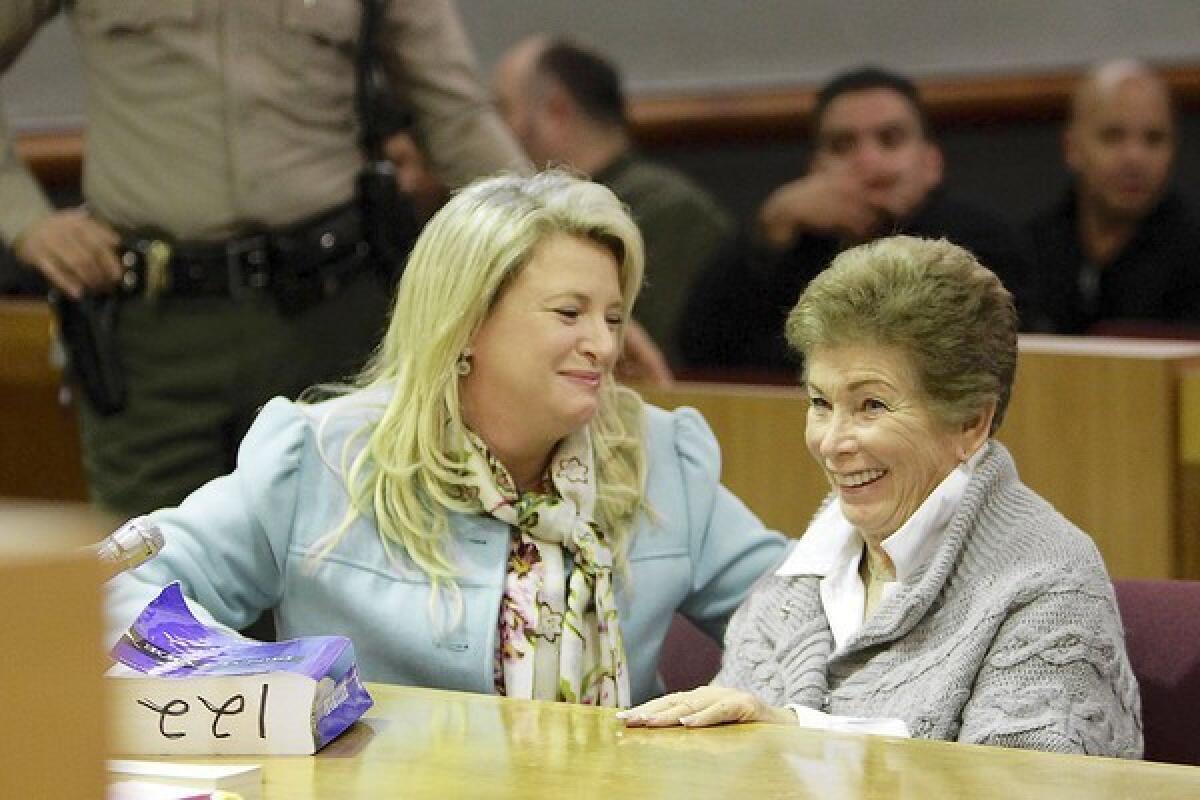 Attorney Alison Triessl, left, and tennis umpire Lois Goodman react with smiles in a courtroom in Van Nuys as the murder charge against Goodman is dropped.