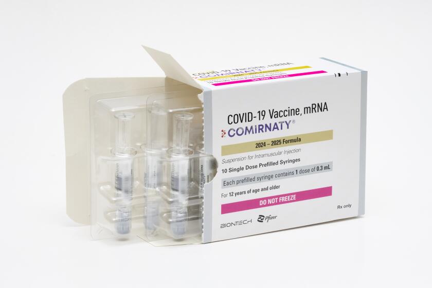 This photo provided by Pfizer in August 2024 shows a packaging for the company's updated COVID vaccine for ages 12 and up, approved by the U.S. Food and Drug Administration on Thursday, Aug. 22, 2024. (Steven Decroos/Pfizer via AP)