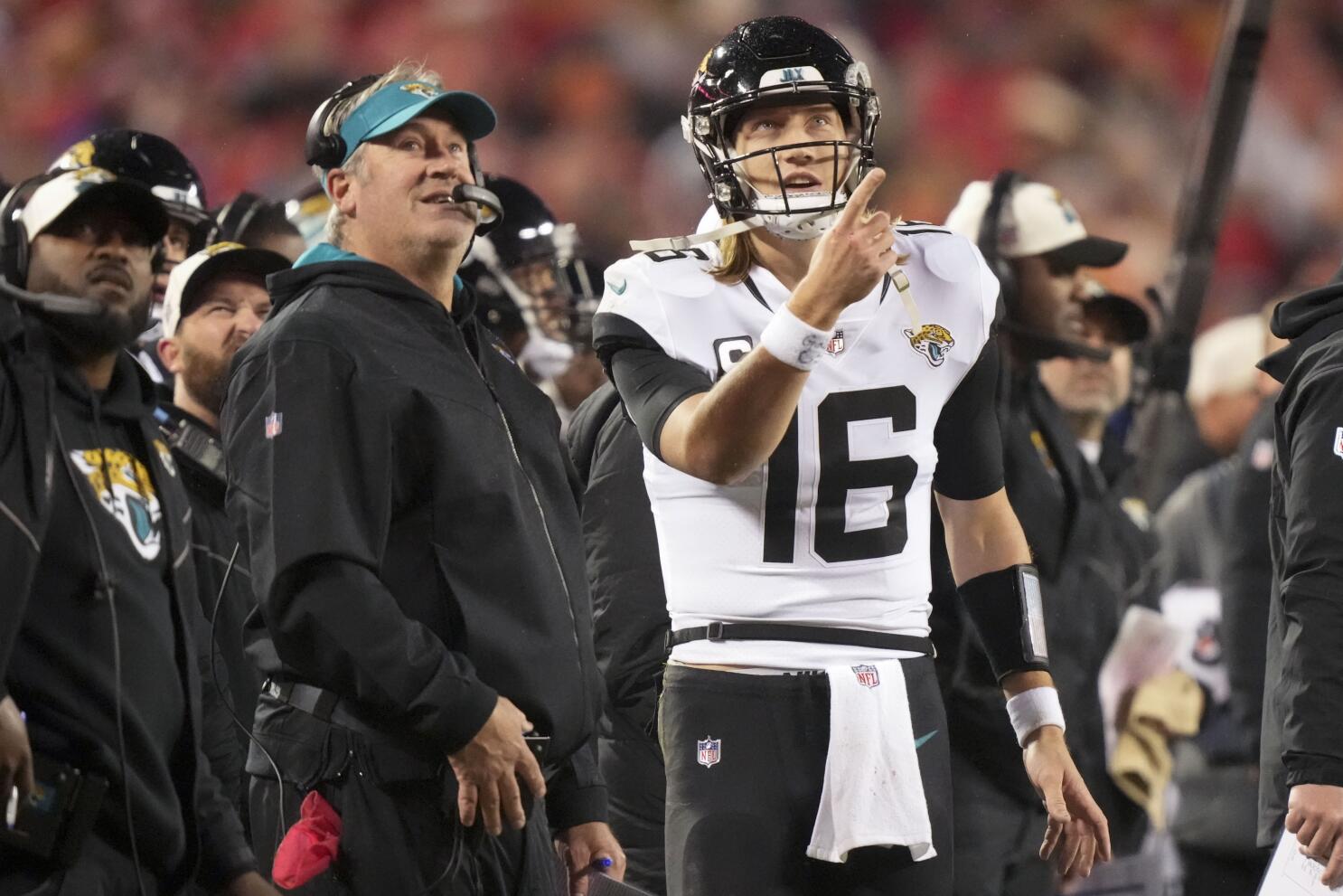 Jacksonville Jaguars quarterback Trevor Lawrence (16) looks for a