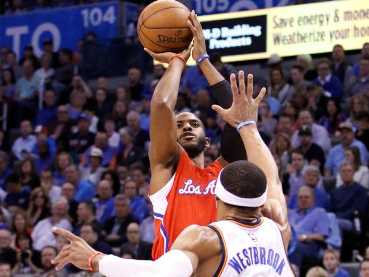 Clippers guard Chris Paul shoots a jumper over Thunder point guard Russell Westbrook in Oklahoma City on March 11.