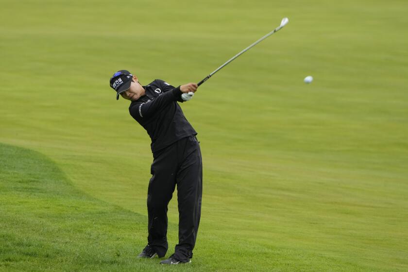 So Mi Lee, of South Korea, hits an approach shot on the eighth hole during the first round of the Mizuho Americas Open golf tournament Thursday, May 16, 2024, in Jersey City, N.J. (AP Photo/Seth Wenig)