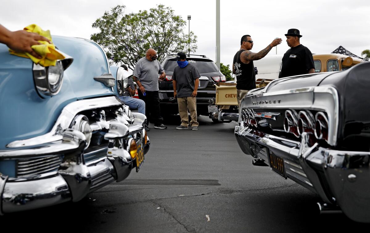 Car clubs meet before a drive along the historic Whittier Boulevard in June 2020.