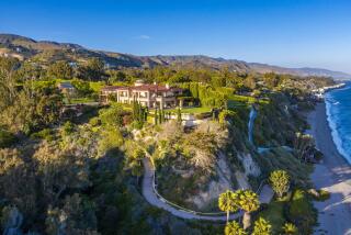 The 3.5-acre spread includes a main house, two guesthouses, tennis court and private path that descends to 208 feet of beach frontage.