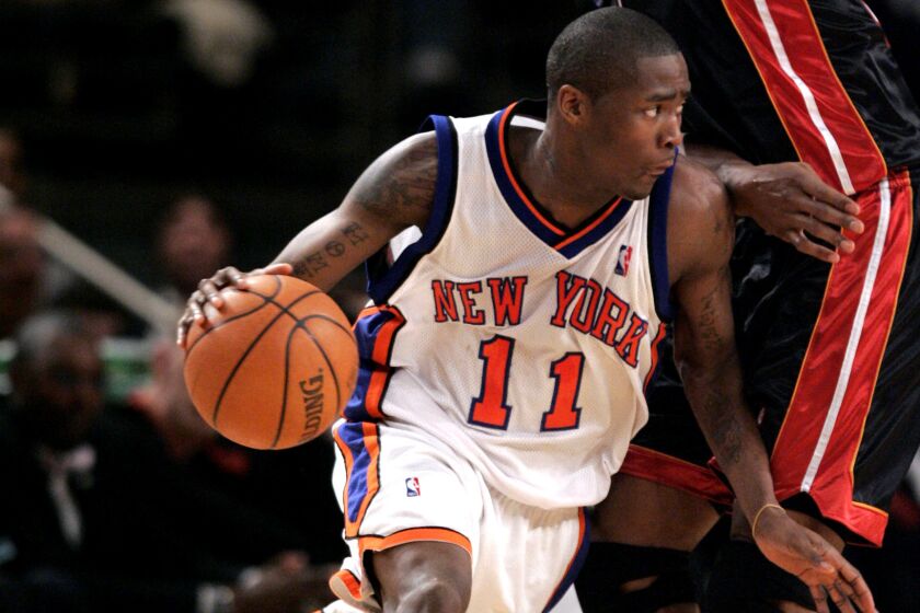 New York Knicks' Jamal Crawford, left, drives around Miami Heat's Udonis Haslem during the third quarter in NBA basketball action Friday, Jan. 26, 2007 at Madison Square Garden in New York. Crawford scored 52 points in the Knick's 11696 win. (AP Photo/Julie Jacobson)