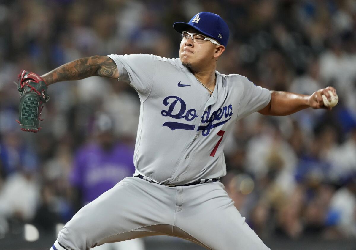 Dodgers starting pitcher Julio Urías delivers against the Colorado Rockies in the seventh inning Friday.
