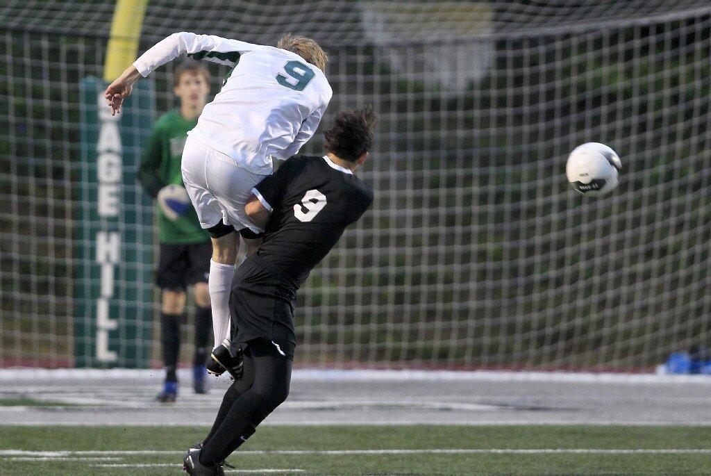 Sage Hill School's Will Burns, top left, is called for a penalty after slamming into Brethren Christian's Andrew Assaf during the first half in an Academy League game on Thursday.