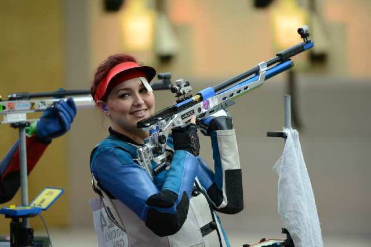 Britain's Jennifer McIntosh acknowledges well-wishers during the 10-meter air rifle competition.