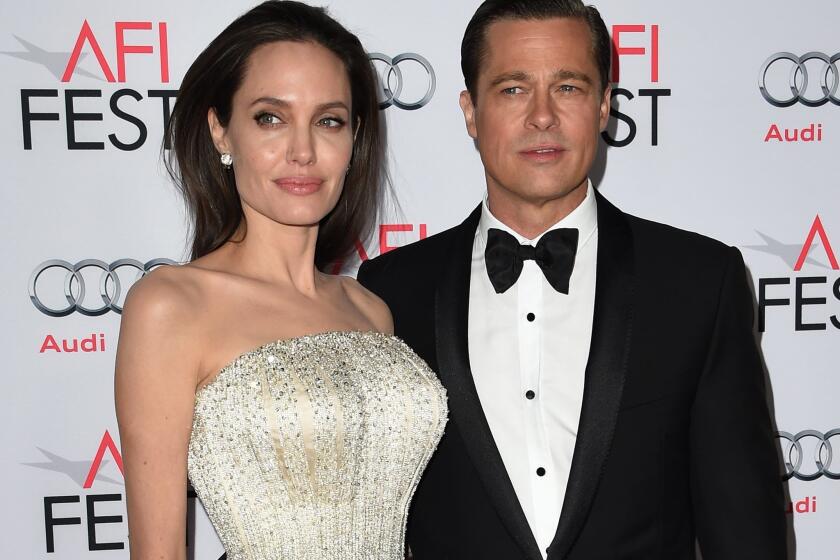 Angelina Jolie and Brad Pitt arrive for the opening-night premiere of "By the Sea" during AFI Fest 2015 at the TCL Chinese Theatre in Hollywood.