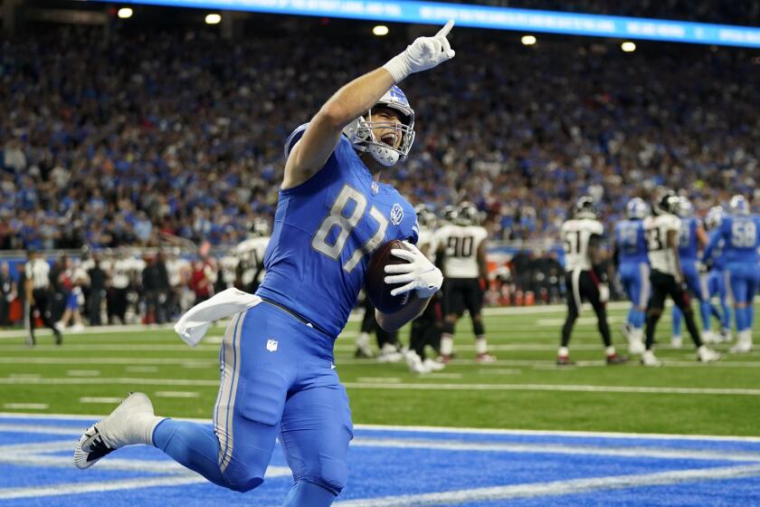 Detroit Lions tight end Sam LaPorta scores a touchdown against the Atlanta Falcons in the first half of an NFL football game Sunday, Sept. 24, 2023, in Detroit. (AP Photo/Paul Sancya)