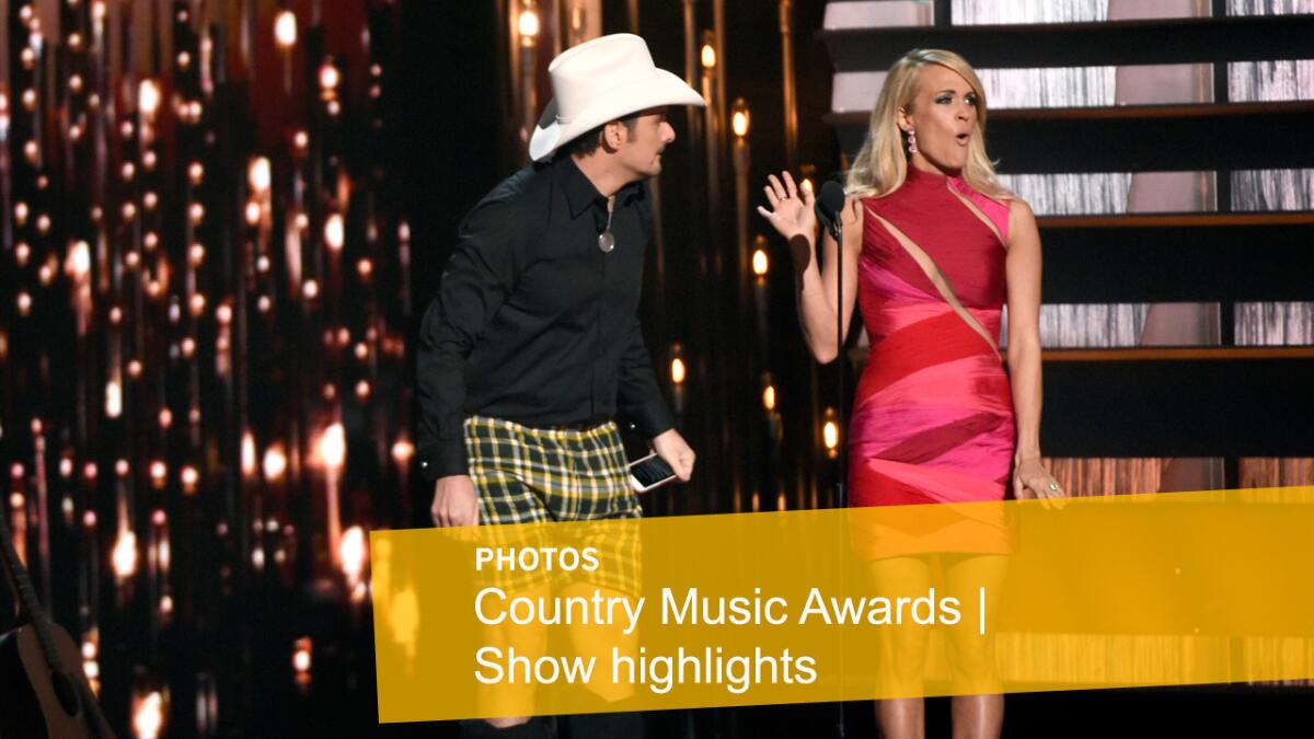 Co-hosts Brad Paisley, left, and Carrie Underwood perform a skit during the opening bit.