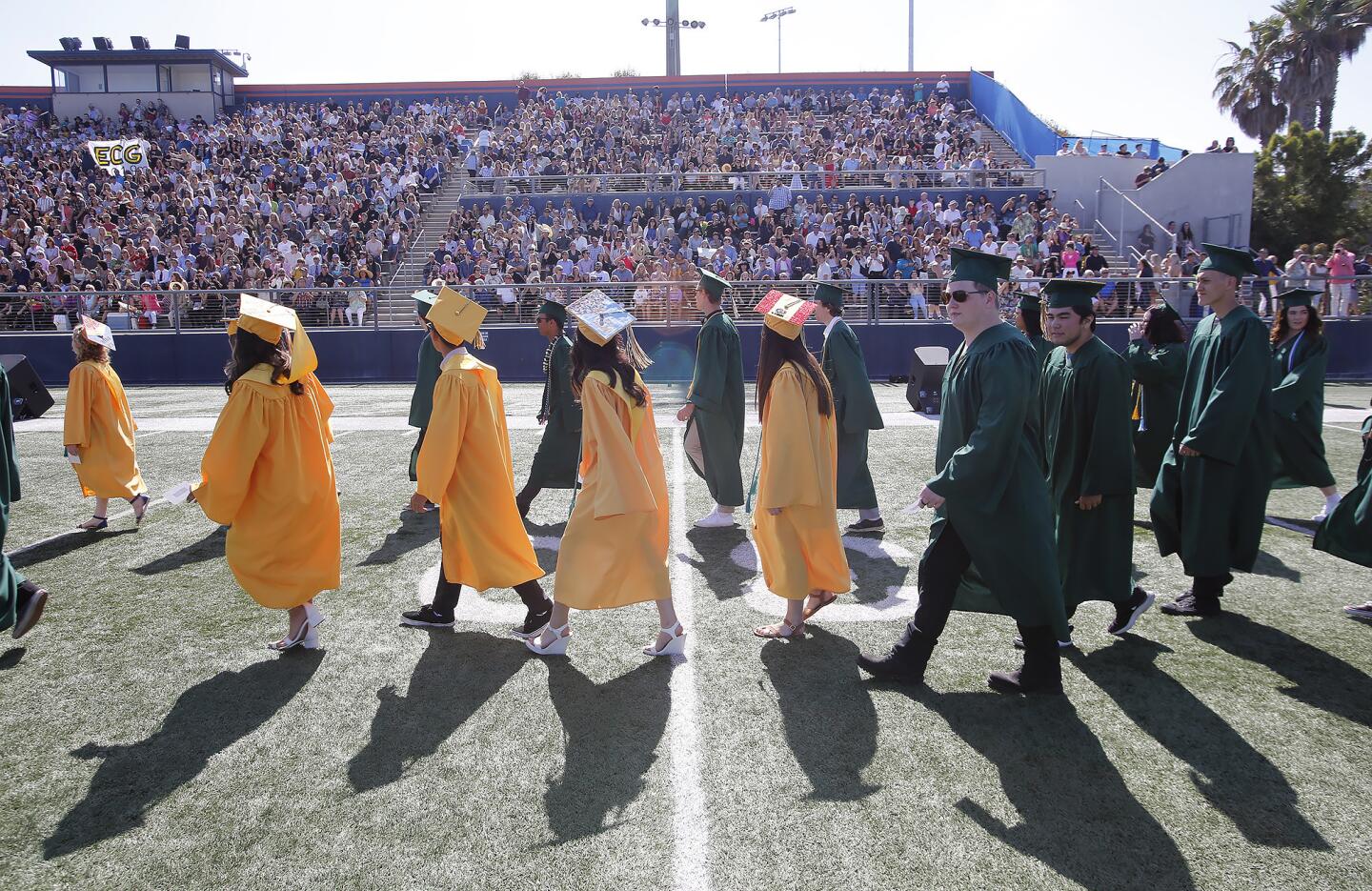 Edison High School graduates enter LeBard Stadium at Orange Coast College for Thursday's Class of 2019 commencement ceremony.
