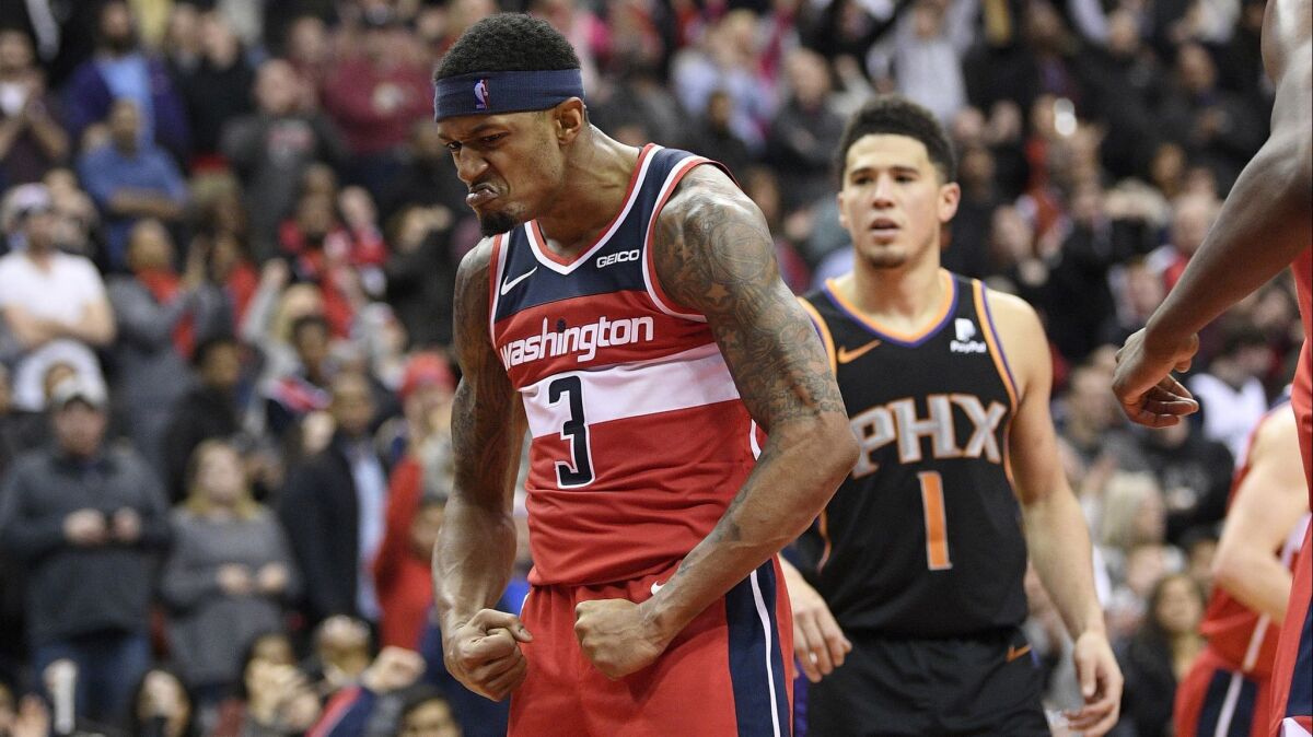 Washington Wizards guard Bradley Beal (3) reacts after making a basket during triple-overtime.