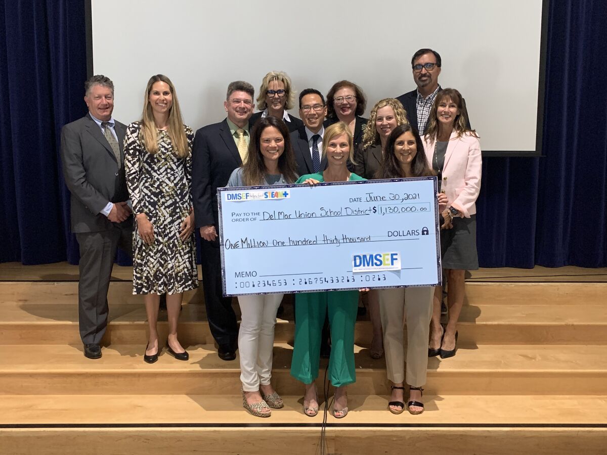 DMSEF presented a check to the Del Mar Union School District board on June 30.