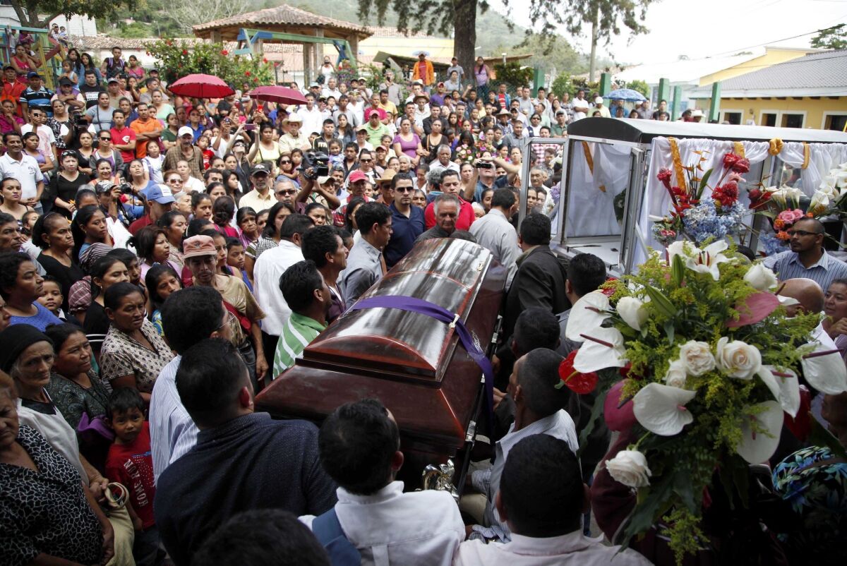 Mourners carry the coffin of slain environmental activist Lesbia Janeth Urquia outside a church in Marcala, Honduras, on July 8.
