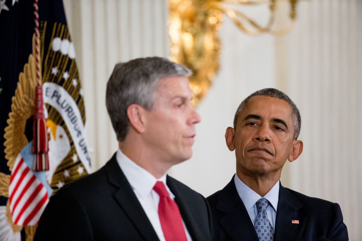 Education Secretary Arne Duncan, left, accompanied by President Obama, earlier this month announces his plans to step down from his post in December. On Monday, the officials met with a Marina del Rey Middle School teacher and others to discuss standardized testing.