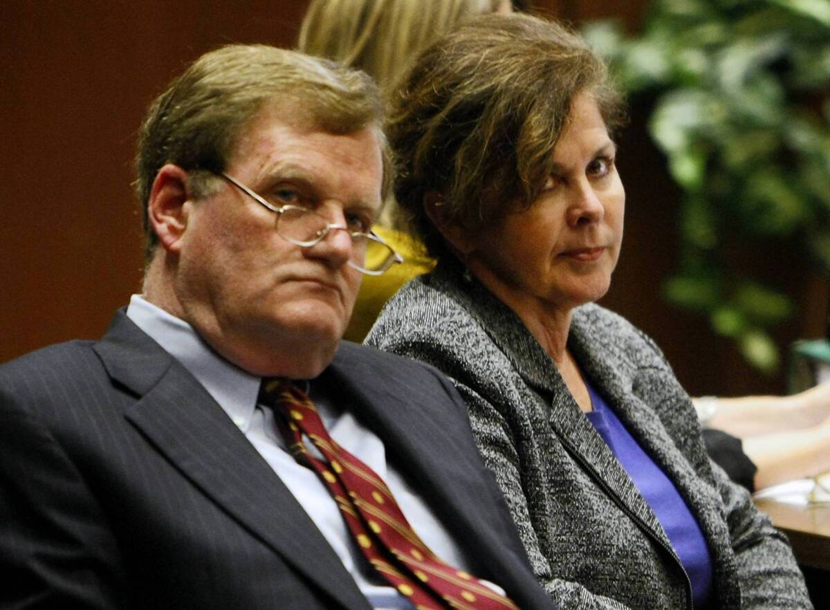 Former assistant city manager of Bell, Angela Spaccia, right, and her attorney, Harland Braun, listen to opening statements in her corruption trial in October.