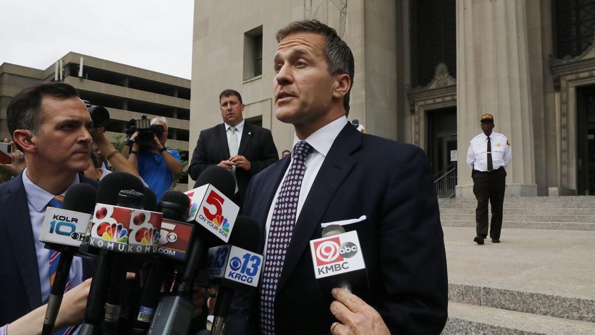 Missouri Gov. Eric Greitens addresses the media on the steps of the Civil Court building on May 14.