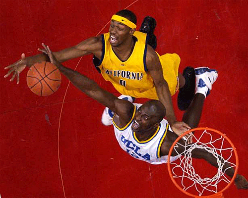 California's Rod Benson, top, goes after a rebound along with UCLA's Alfred Aboya at the Pac-10 conference basketball tournament final game, Saturday, March 11, 2006, in Los Angeles. UCLA won 71-52.