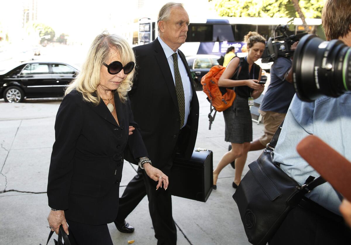 Shelly Sterling, accompanied by her attorney Pierce O'Donnell, walks into a Los Angeles County Courthouse. She is asking a judge approve the removal of her husband Donald Sterling from the family trust that owns the Clippers to complete the $2-billion sale of the team to Steve Ballmer.