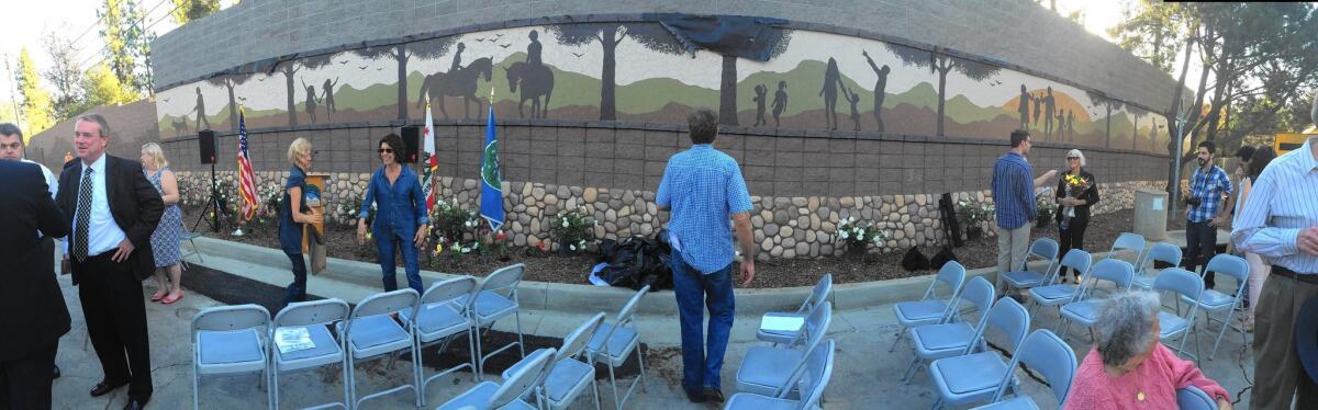 A panoramic photograph of artwork done by artist Miriam Balcazar on the soundwall at Curran St. and Indiana Ave. in La Cañada Flintridge on Tuesday, Oct. 28, 2014. The artwork is a 90-ft. long tile mosaic with various scenes.