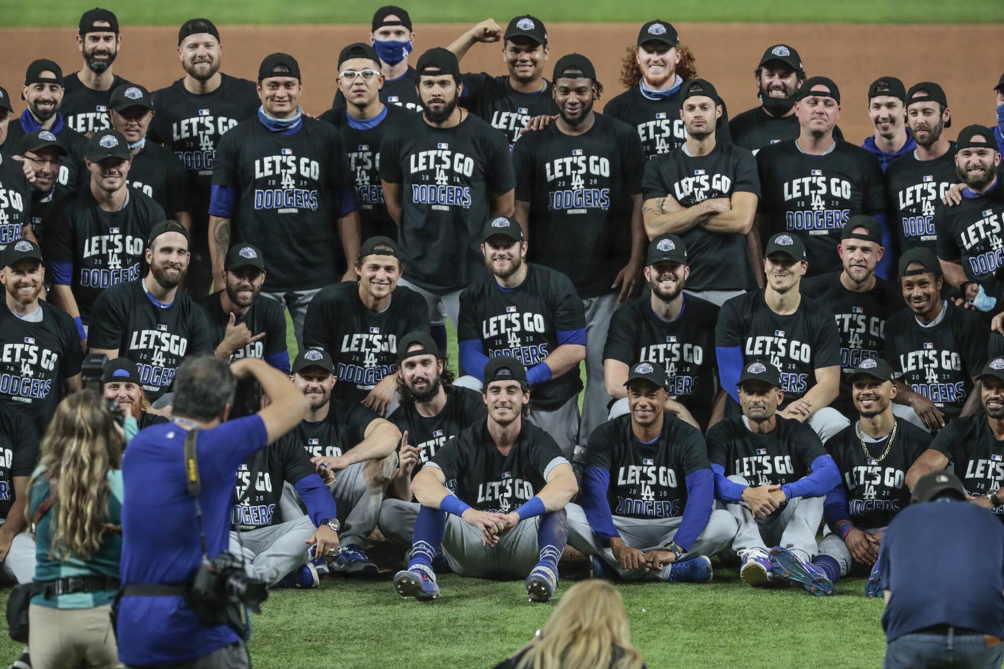 Dodgers players celebrate at Globe Life Field in Arlington, Texas, after sweeping the San Diego Padres.
