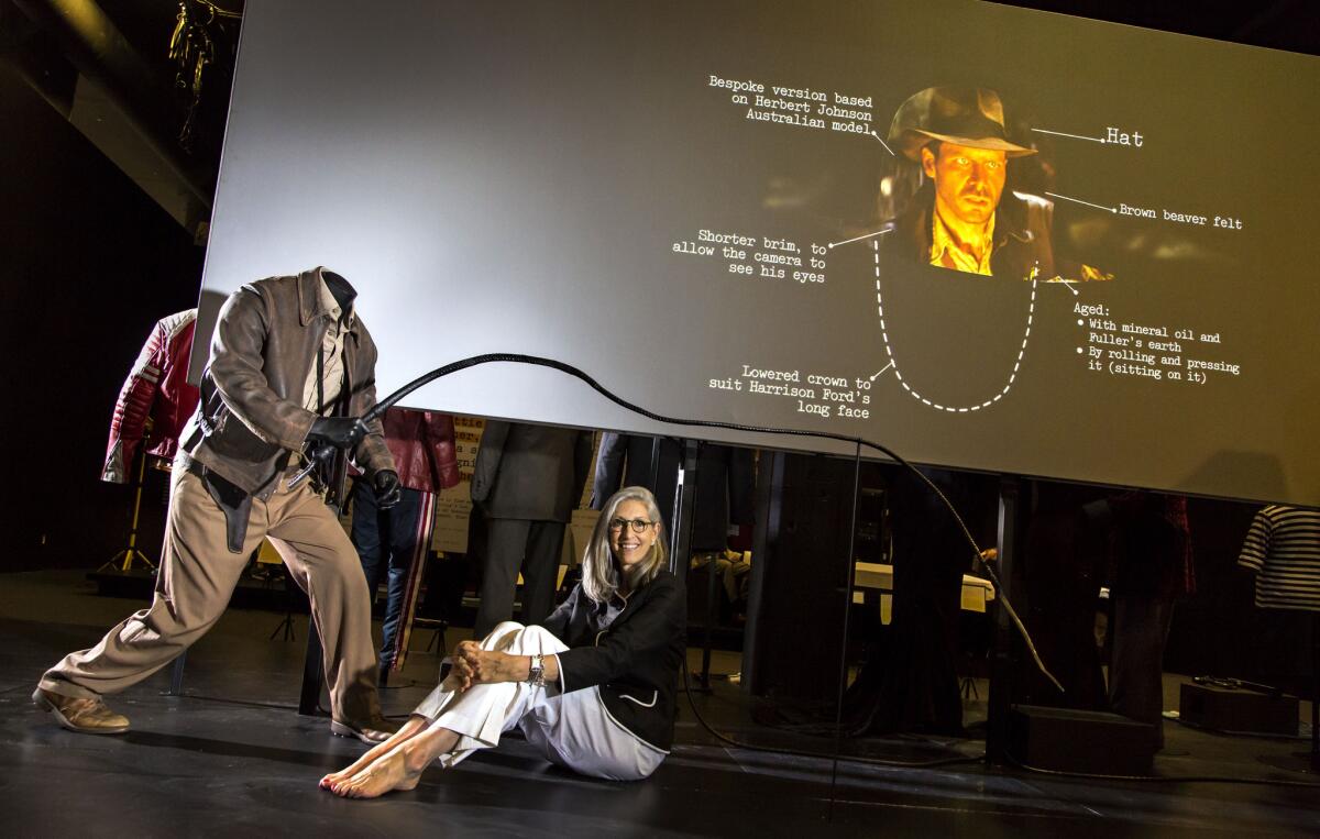 Curator-designer Deborah Nadoolman Landis poses with the Indiana Jones costumes in the future site of the Academy Museum at LACMA.