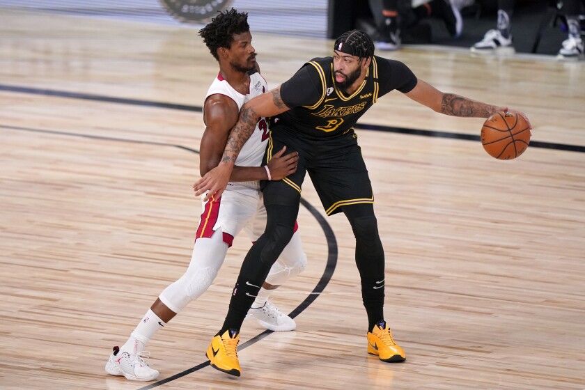 Heat forward applies pressure defense against Lakers forward Anthony Davis during Game 2.