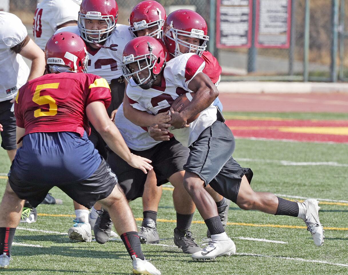 GCC's Nate Degraffinreaidt runs with the ball for a play at Glendale Community College football practice on Thursday, August 16, 2018. The first game of the season will be September 1 against Antelope Valley.