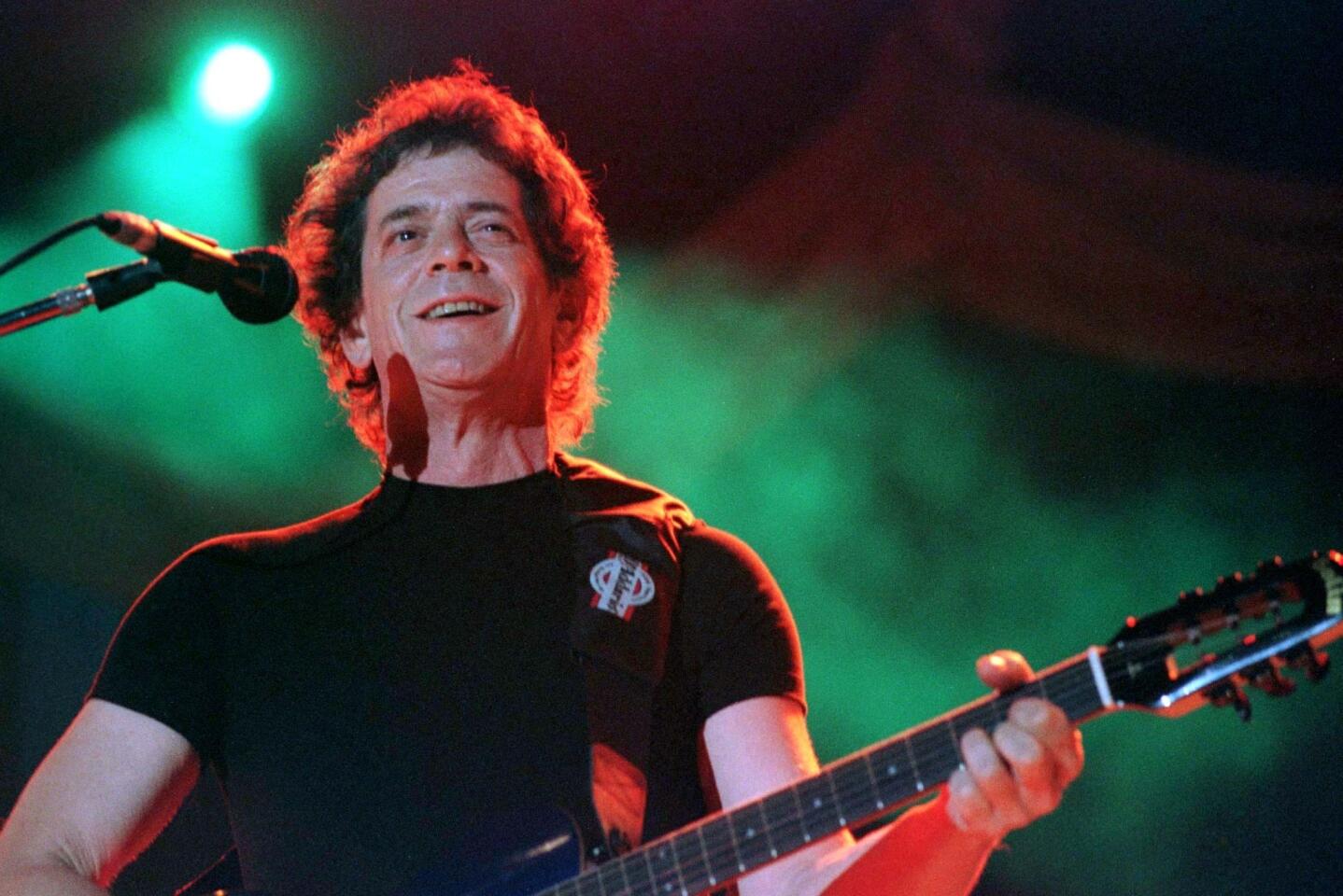 Famous rock singer Lou Reed performs at the Panathinaikos stadium in Athens during a rock festival, July 1, 1996. The two-day festival included performances from David Bowie and Elvis Costello.