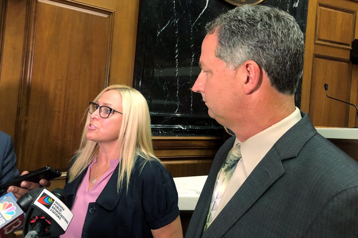 Indiana state Rep. Wendy McNamara, left, R-Evansville, speaks with reporters alongside House Speaker Todd Huston, right, R-Fishers, at the Indiana Statehouse in Indianapolis on Monday, Aug. 1, 2022. McNamara and Huston both said they favored keeping exceptions for rape and incest victims in a bill aiming to ban most abortions in the state, putting them at odds with some other Republican legislators. (AP Photo/Tom Davies)