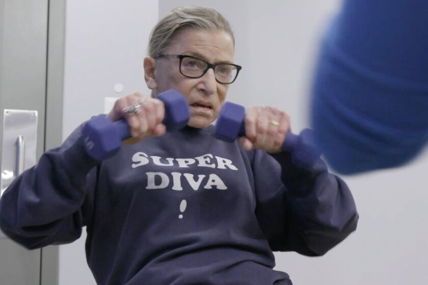 Justice Ruth Bader Ginsburg mid workout routine in "RBG" movie, a Magnolia Pictures release. Photo courtesy of Magnolia Pictures.