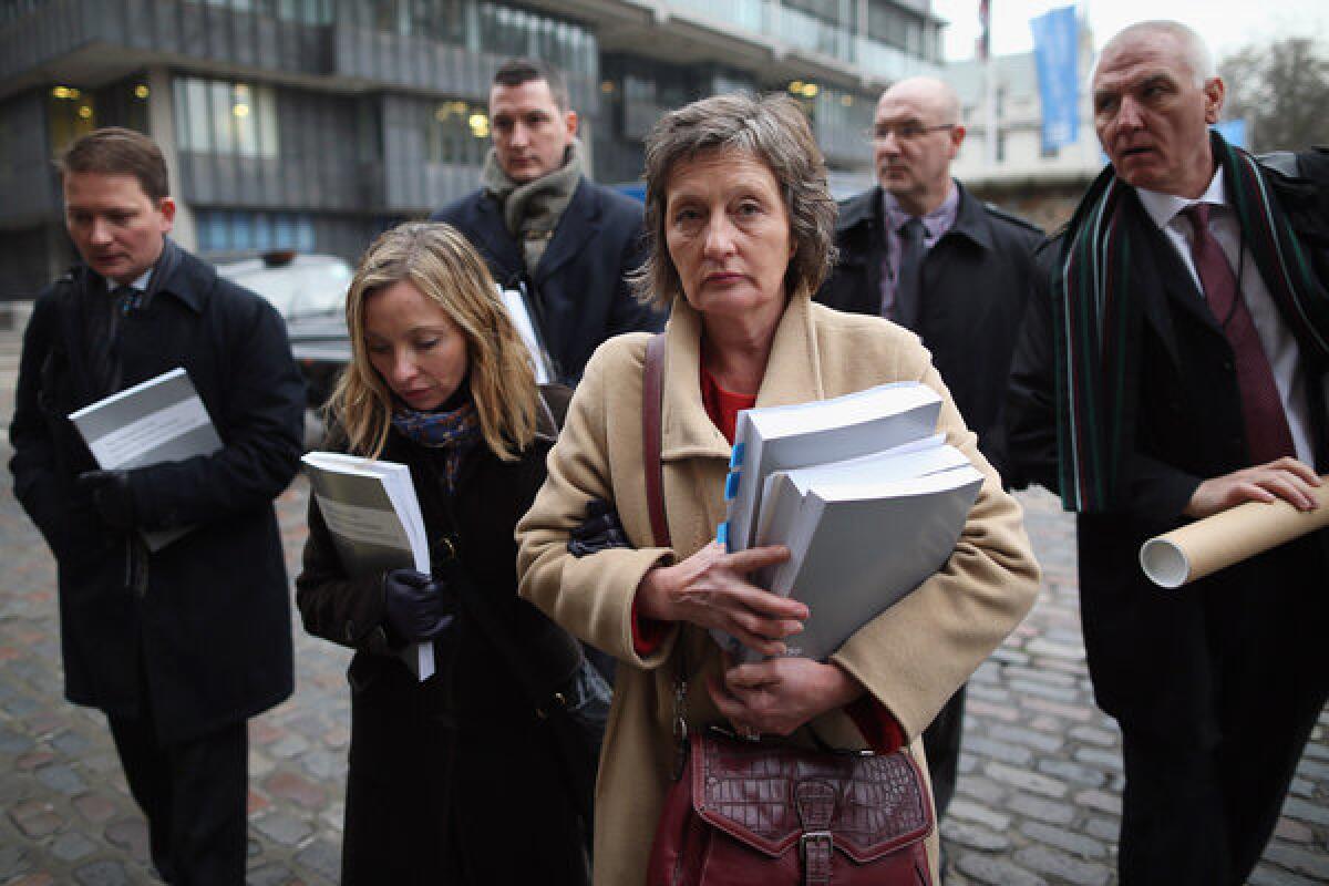 Geraldine Finucane, center, and other members of the Finucane family arrive at Methodist Central Hall to make a statement Wednesday in London.