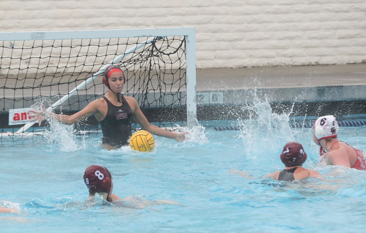 Laguna Beach goalie Lauren Schneider makes a save on San Marcos during the semifinals of the Bill Barnett Holiday Cup.