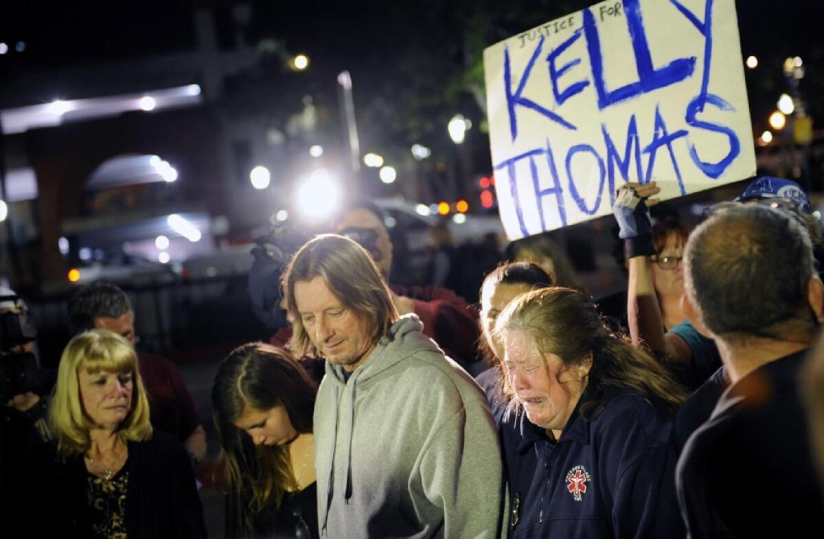 Friends, family and supporters stand at "Kelly's Corner." 