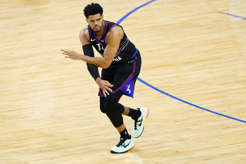 Philadelphia 76ers' Tobias Harris reacts after making a three-pointer during the second half of Game 1.