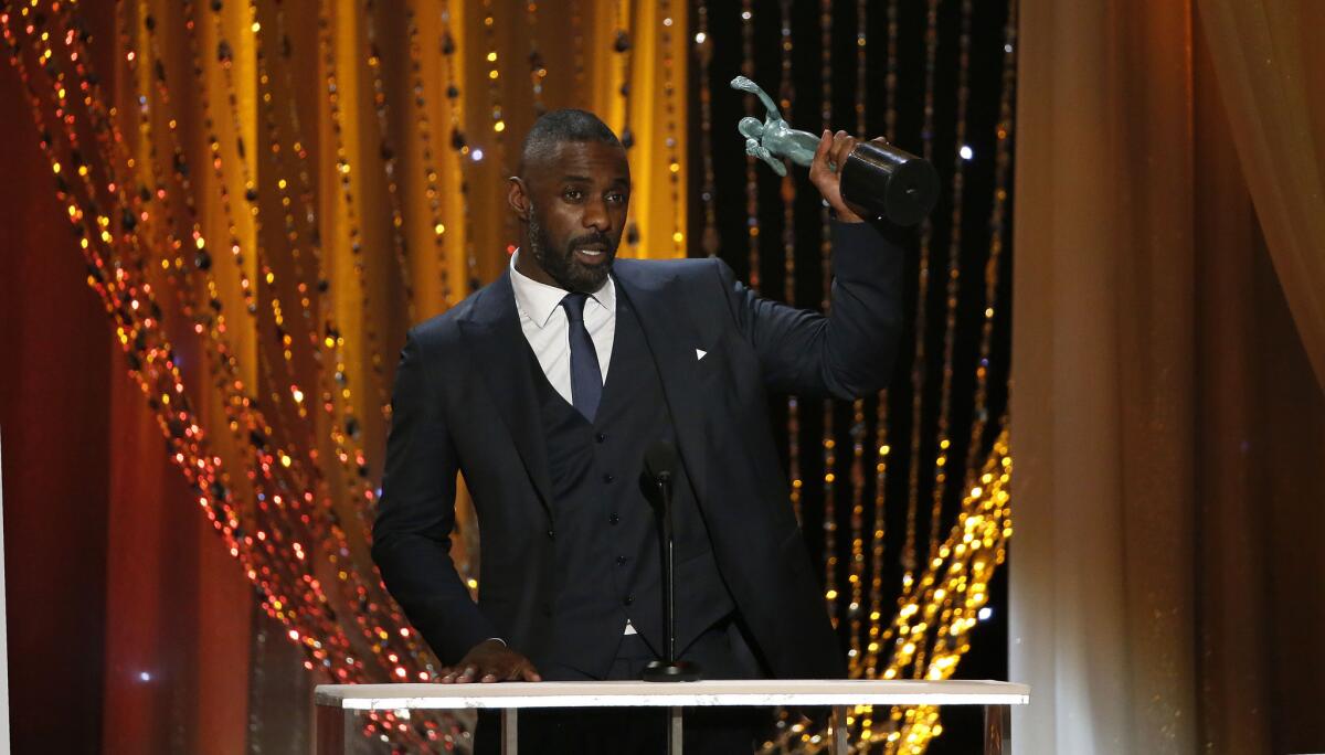 Idris Elba with his SAG Award for male actor in a supporting role at the 22nd Screen Actors Guild Awards.