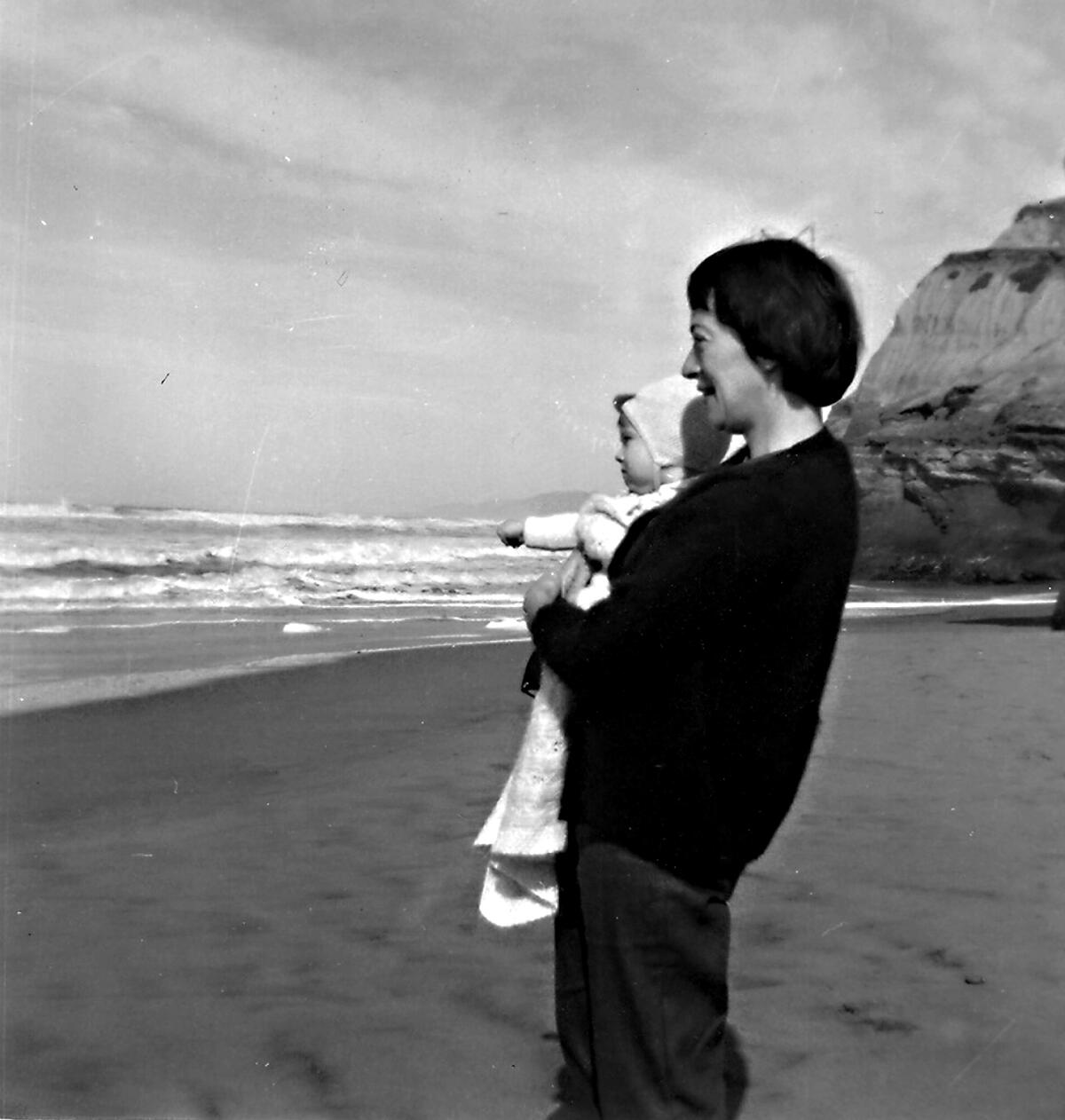Ursula K. Le Guin with Caroline on the Oregon coast, 1960.