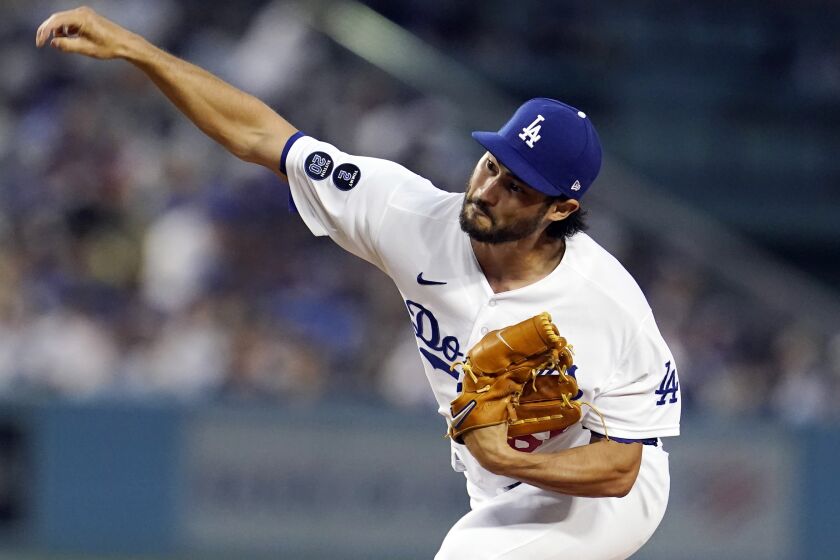 Los Angeles Dodgers relief pitcher Mitch White throws to a Pittsburgh Pirates batter during the second inning.