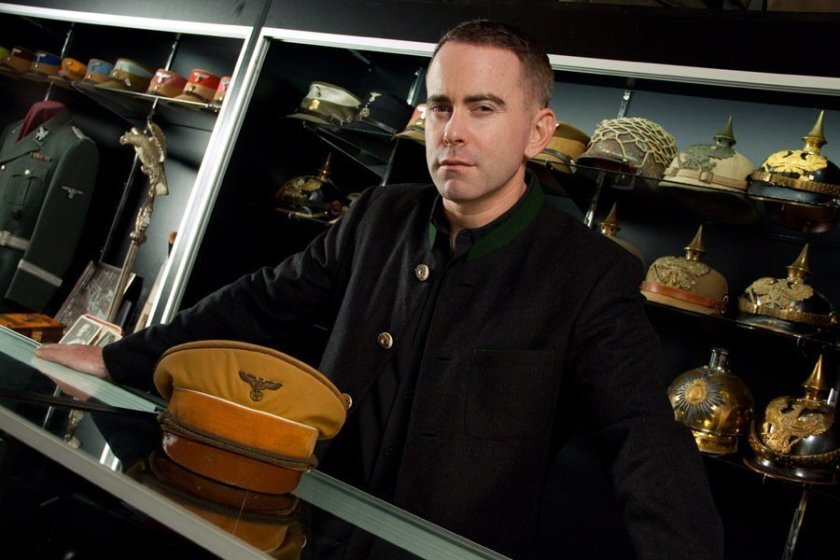 Military artifacts dealer Craig Gottlieb of Del Mar photographed in 2014 with Adolf Hitler's uniform hat, which he acquired with other Hitler items from a collector that year and is selling at auction in Germany on Sept. 28.