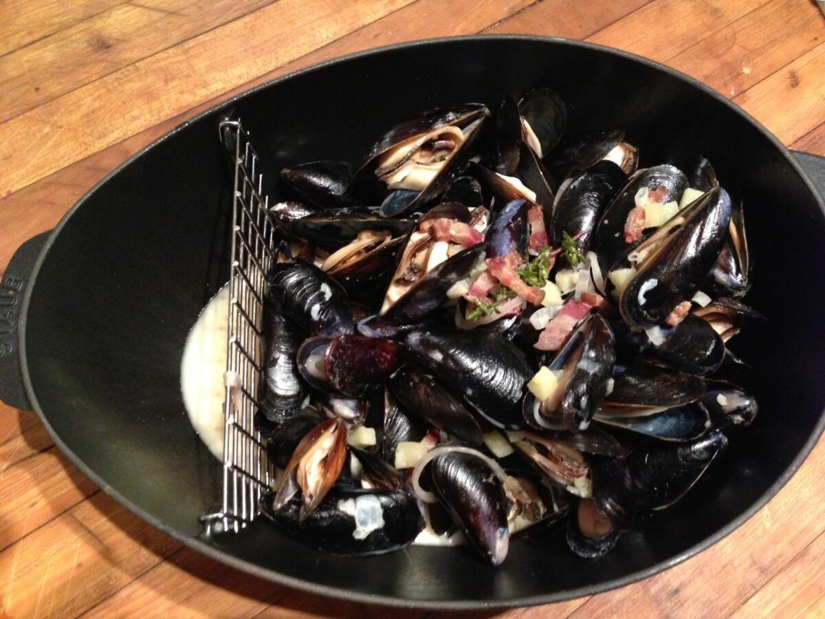 Mussels with bacon, apple and shallot pair beautifully with a premier cru Chablis from William Fevre. The recipe is from Seattle chef John Sundstrom's new book "Lark: Cooking Against the Grain."
