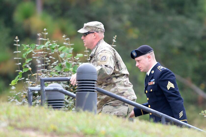 Sgt. Bowe Bergdahl, right, arrives for a motions hearing at Fort Bragg, N.C. on Monday.